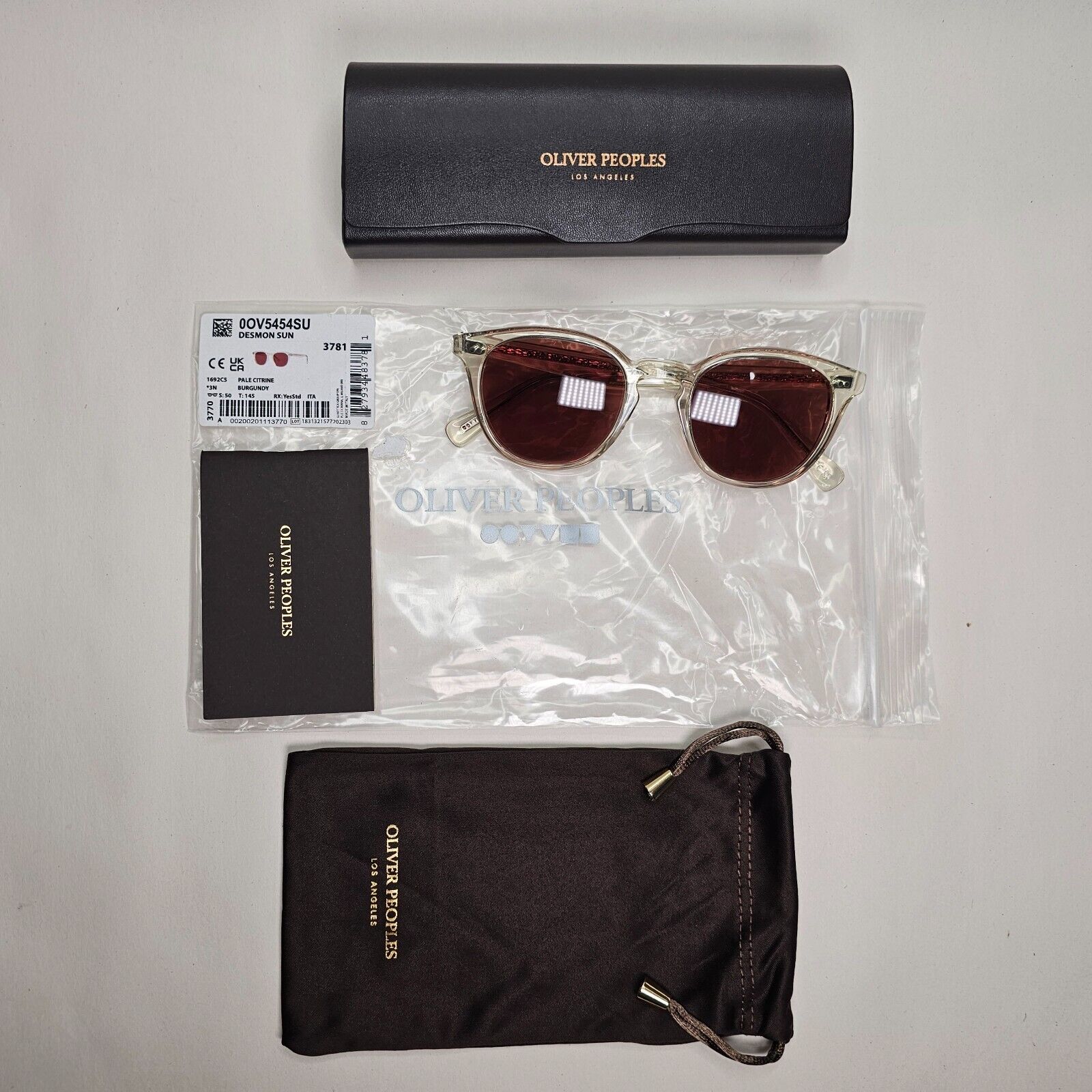 Oliver Peoples Desmon Sunglasses Transparent Yellow Bordo OV 5454SU 1692/C5 50mm