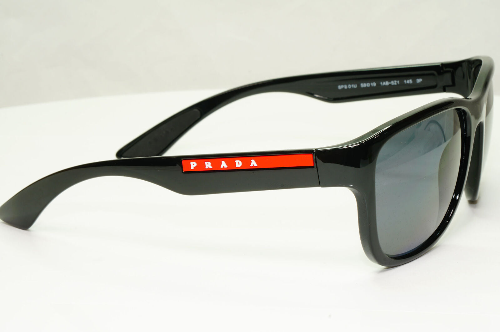 Prada Polarised Black Sunglasses Square Red Stripe PS01US SPS 01U 1AB-5Z1 59mm