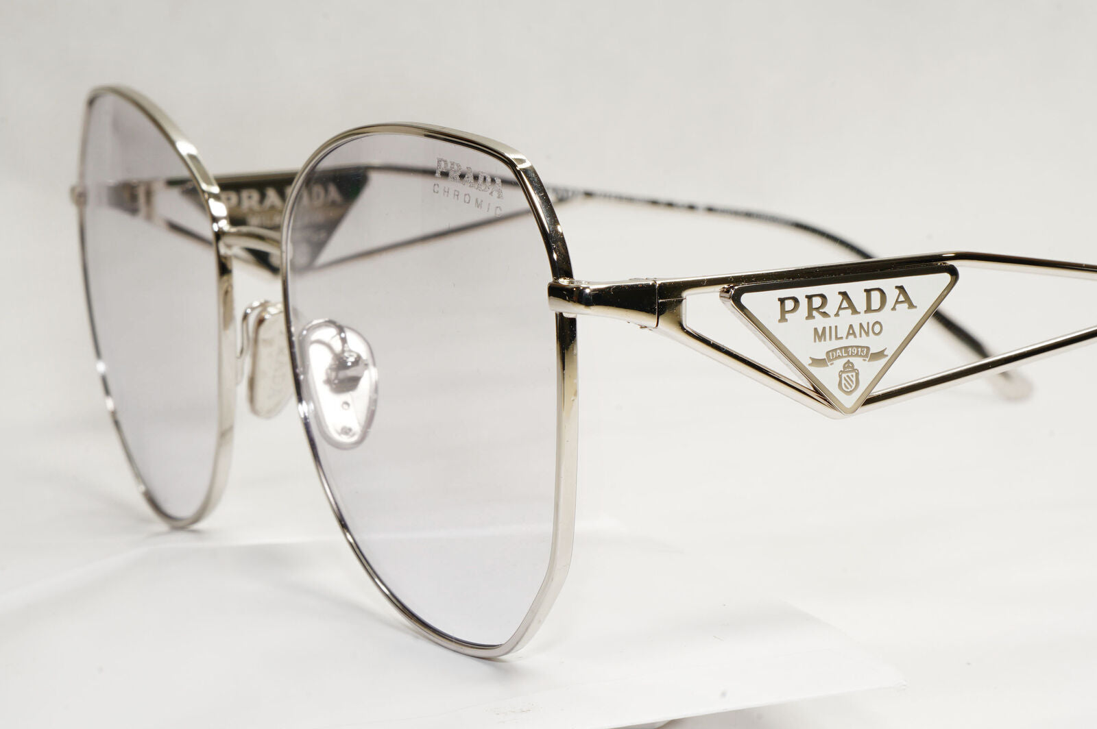 Prada Sunglasses Photochromic Grey Silver Triangle PR57YS SPR 57Y 1BC-07D