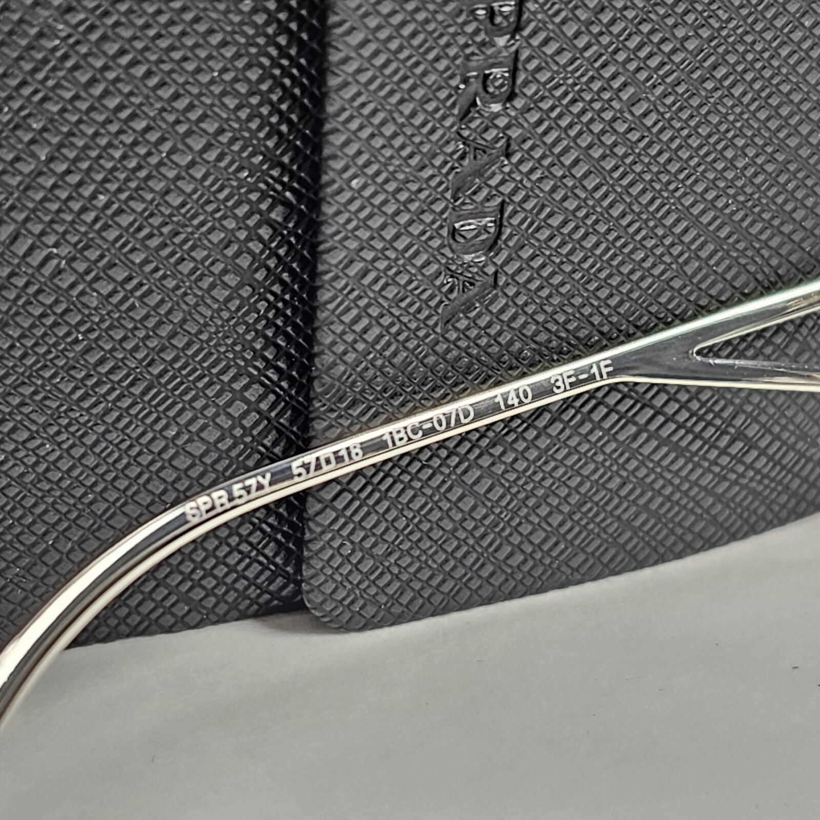 Prada Sunglasses Photochromic Grey Silver Triangle PR57YS SPR 57Y 1BC-07D