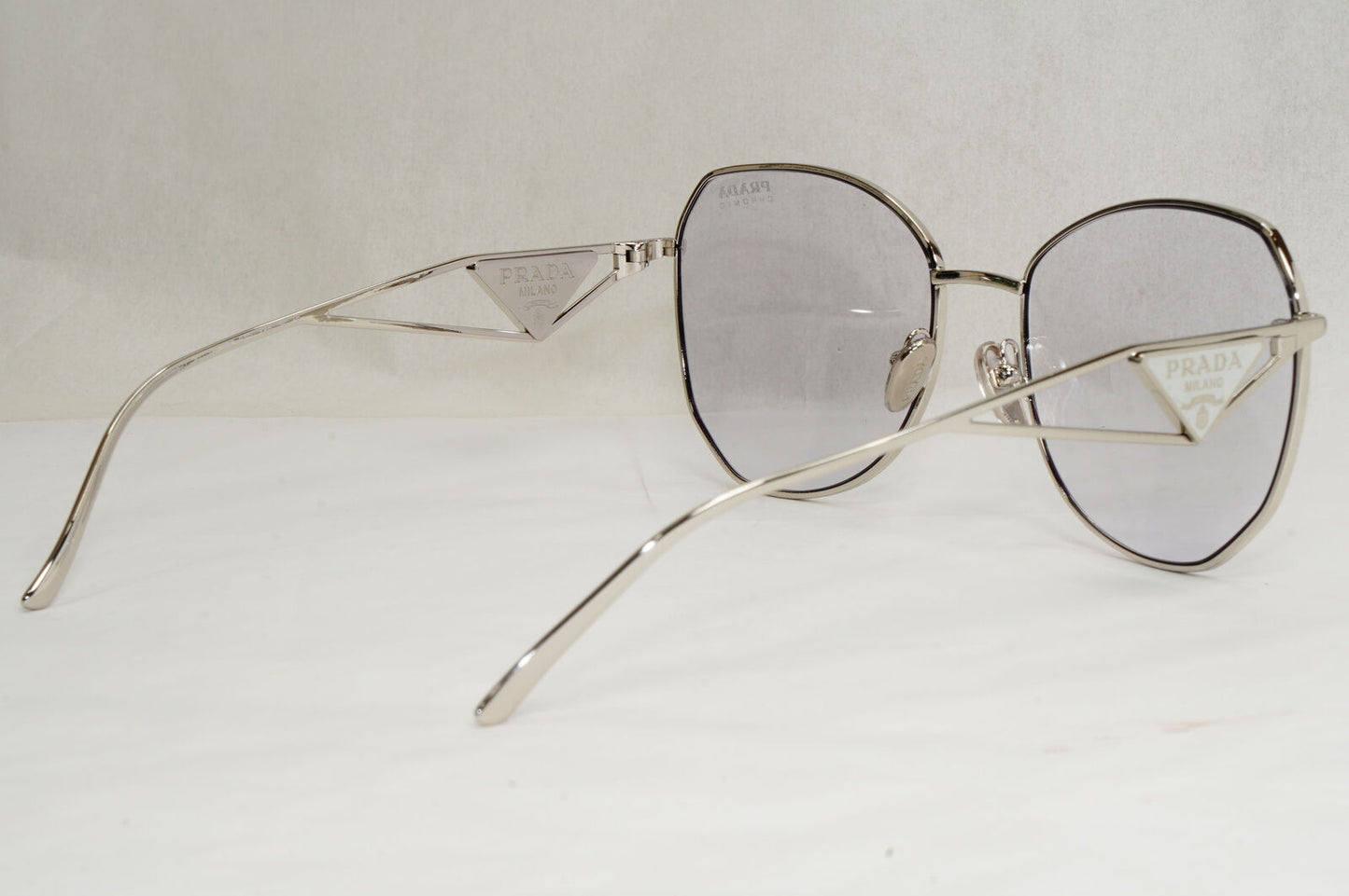 Prada Sunglasses Photochromic Grey Silver Triangle PR57YS SPR 57Y 1BC-07D