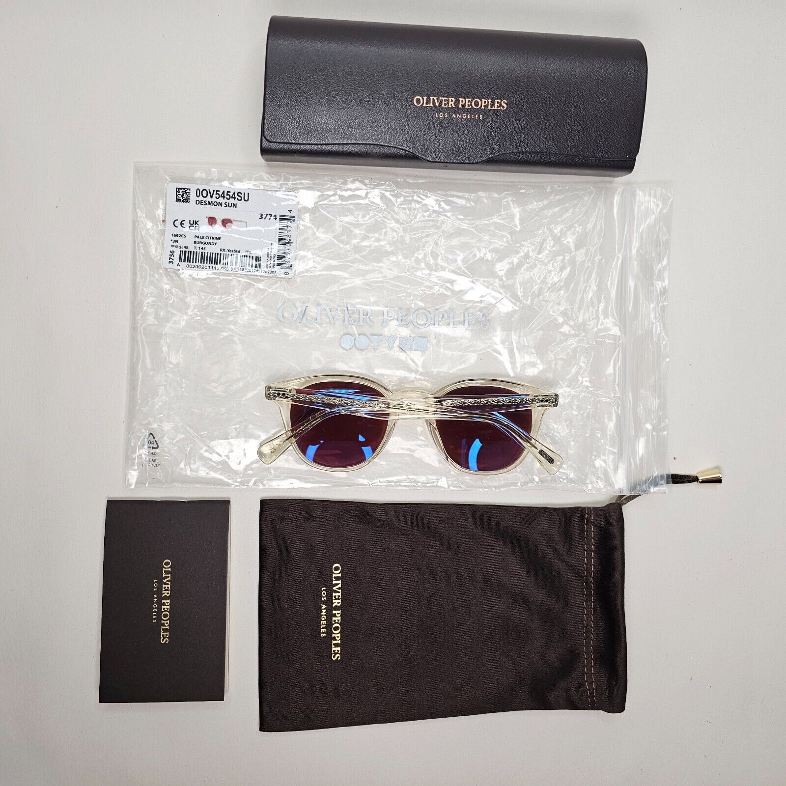 Oliver Peoples Desmon Sunglasses Transparent Yellow Bordo OV 5454SU 1692/C5 48mm